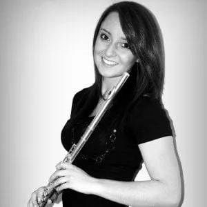 teenage girl holding a flute